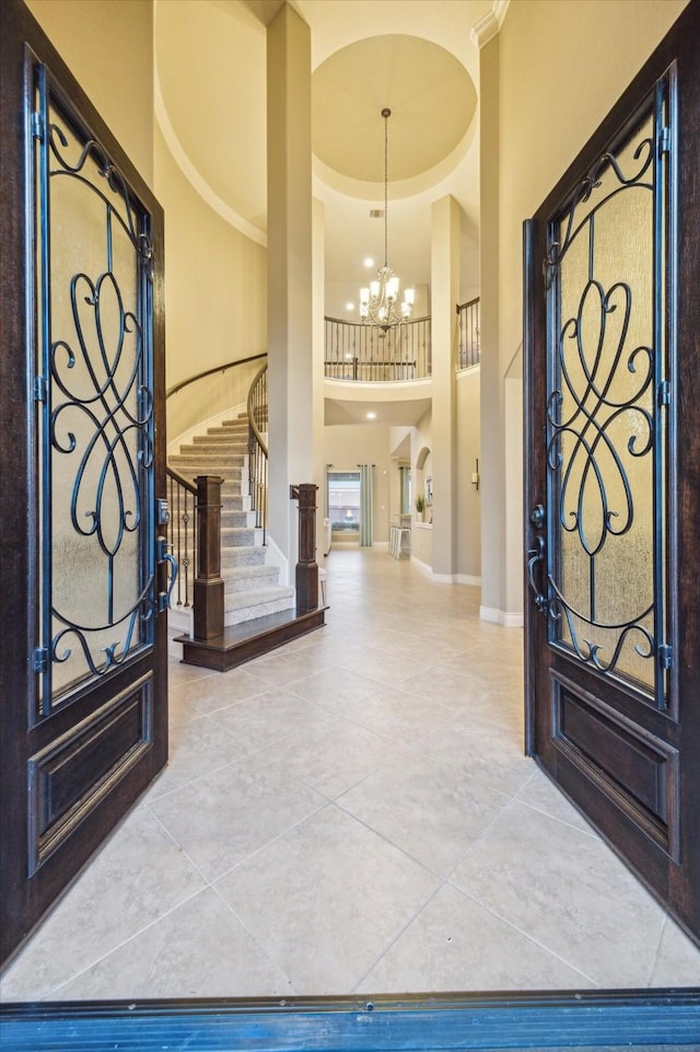 2011 Greenvine Cir, Katy, TX 77494 - tiled entrance foyer with a high ceiling, a chandelier, stairway, and baseboards