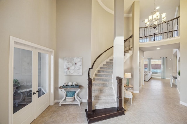 2011 Greenvine Cir, Katy, TX 77494 - tiled foyer with a high ceiling, french doors, stairs, a chandelier, and baseboards