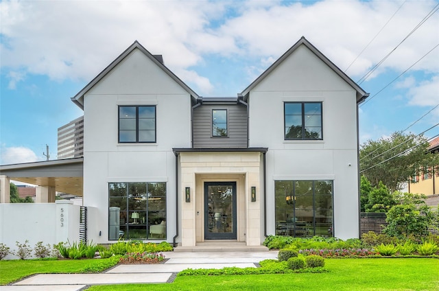 5603 Doliver Dr, Houston, TX 77056 - view of front facade featuring stucco siding and a front lawn