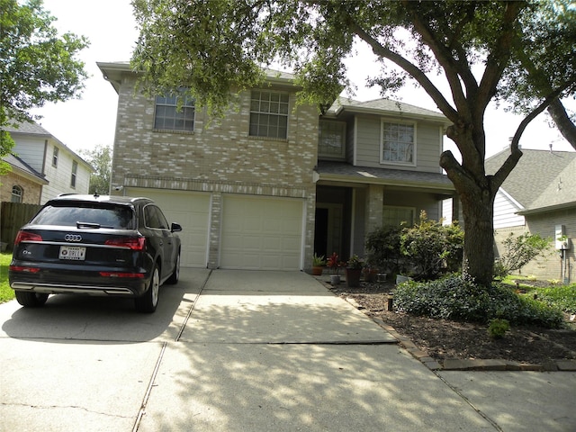 view of front of home with brick siding, driveway, and an attached garage
