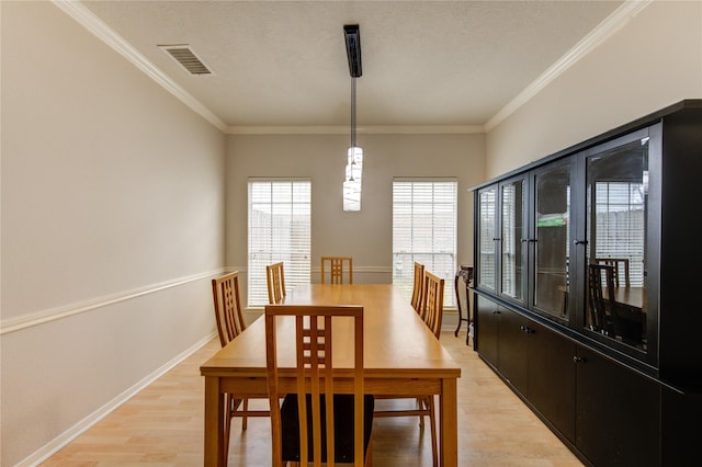 1635 Pebble Banks, Pasadena, TX 77586 - dining room featuring light wood-style floors, ornamental molding, and baseboards