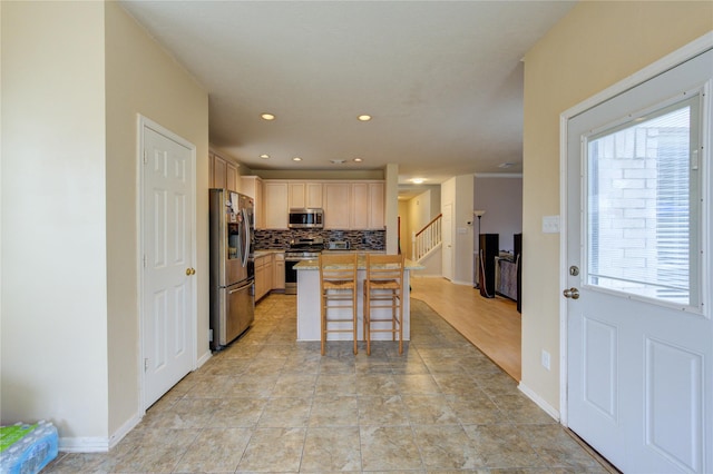 1635 Pebble Banks, Pasadena, TX 77586 - kitchen with stainless steel appliances, backsplash, a kitchen breakfast bar, recessed lighting, and a kitchen island