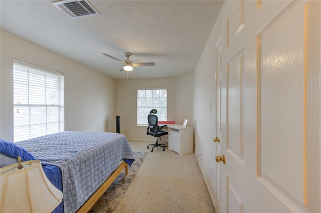 1635 Pebble Banks, Pasadena, TX 77586 - bedroom featuring light carpet, a ceiling fan, a textured ceiling, and baseboards