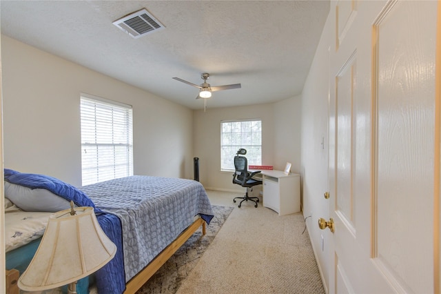 1635 Pebble Banks, Pasadena, TX 77586 - bedroom featuring carpet flooring, an office area, a ceiling fan, and a textured ceiling