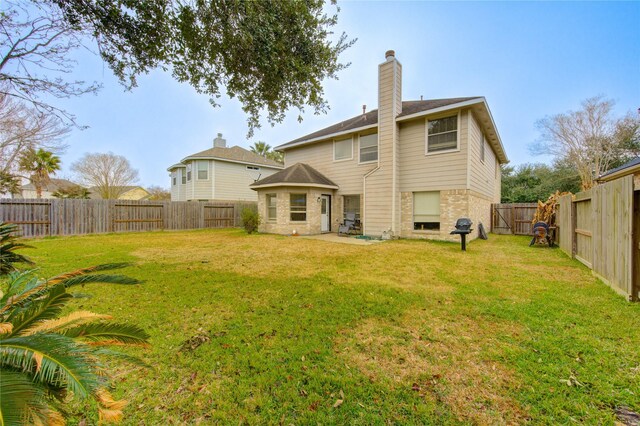 1635 Pebble Banks, Pasadena, TX 77586 - rear view of property featuring a chimney and brick siding