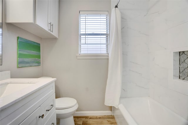 5810 Verdome Ln, Houston, TX 77092 - full bath featuring vanity, baseboards, toilet, shower / bath combination with curtain, and wood finished floors