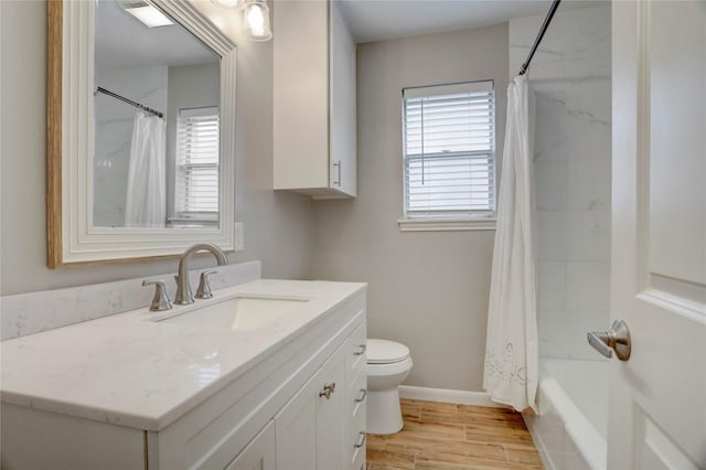 5810 Verdome Ln, Houston, TX 77092 - full bathroom with healthy amount of natural light, toilet, vanity, and wood finished floors
