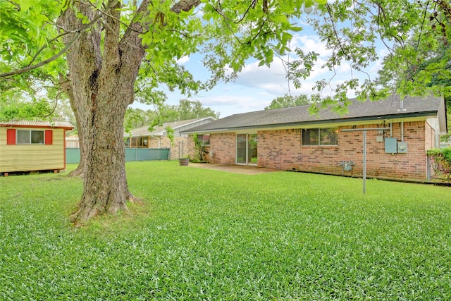 5810 Verdome Ln, Houston, TX 77092 - rear view of house featuring brick siding and a patio