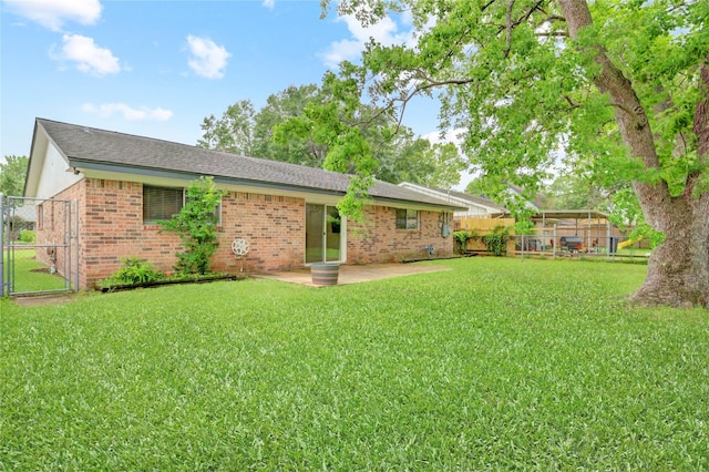 5810 Verdome Ln, Houston, TX 77092 - rear view of property featuring brick siding, a gate, a patio, and a shingled roof