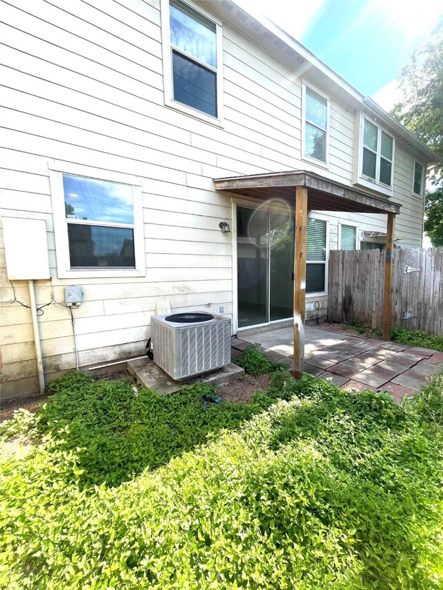 13150 Lawsons Creek Ln, Houston, TX 77072 - back of property with central AC and a patio area