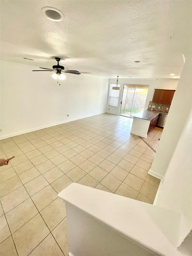 13150 Lawsons Creek Ln, Houston, TX 77072 - unfurnished living room with light tile patterned floors, a textured ceiling, and ceiling fan