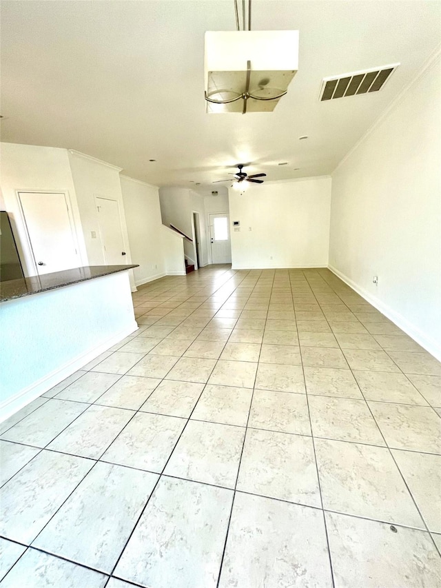 13150 Lawsons Creek Ln, Houston, TX 77072 - unfurnished room with light tile patterned floors, a ceiling fan, baseboards, and crown molding