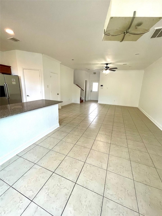 13150 Lawsons Creek Ln, Houston, TX 77072 - unfurnished living room featuring light tile patterned flooring, ceiling fan, baseboards, and stairs