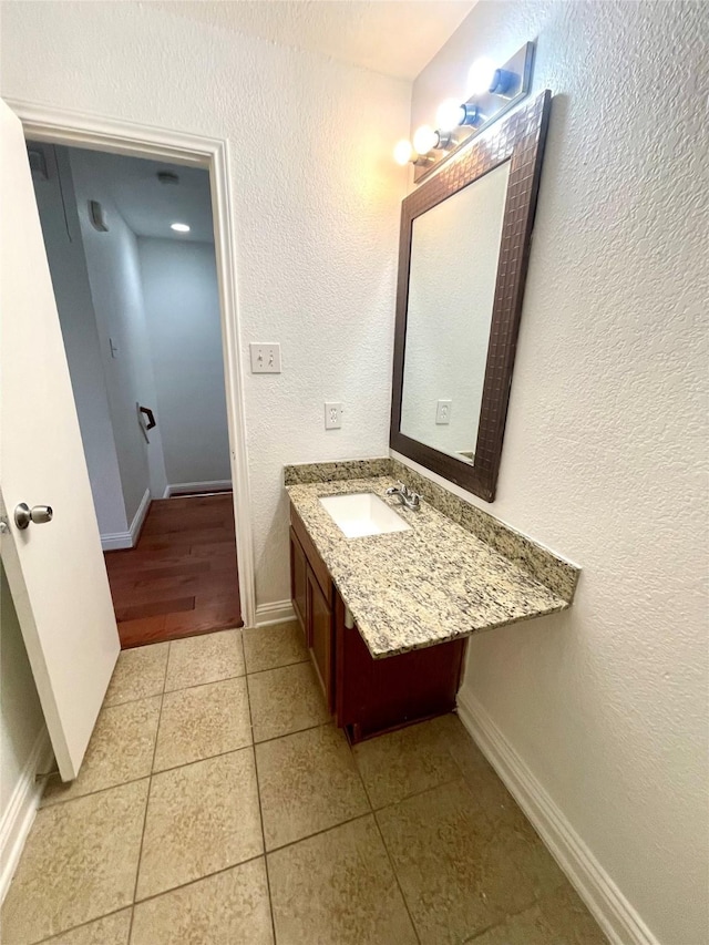 13150 Lawsons Creek Ln, Houston, TX 77072 - bathroom with tile patterned flooring, vanity, and baseboards