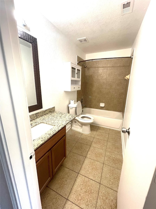 13150 Lawsons Creek Ln, Houston, TX 77072 - bathroom featuring toilet, a textured ceiling, tile patterned floors, tub / shower combination, and vanity