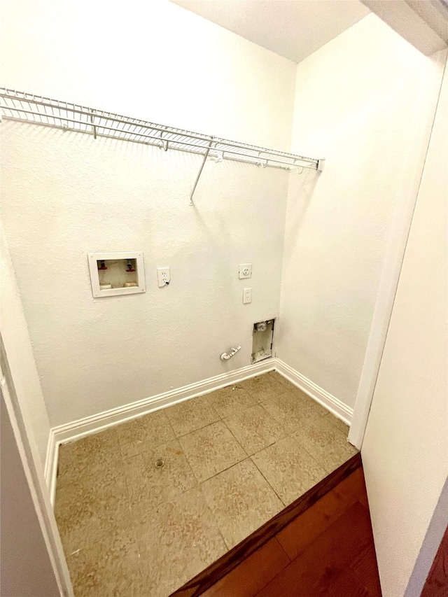 13150 Lawsons Creek Ln, Houston, TX 77072 - washroom featuring hookup for a gas dryer, electric dryer hookup, hookup for a washing machine, baseboards, and tile patterned flooring