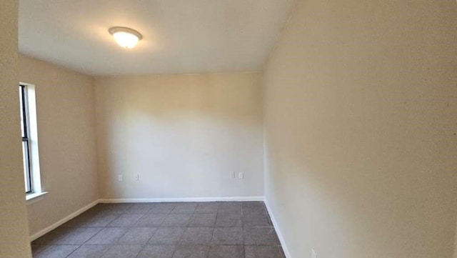 3418 Memel St, Houston, TX 77026 - tiled empty room with baseboards