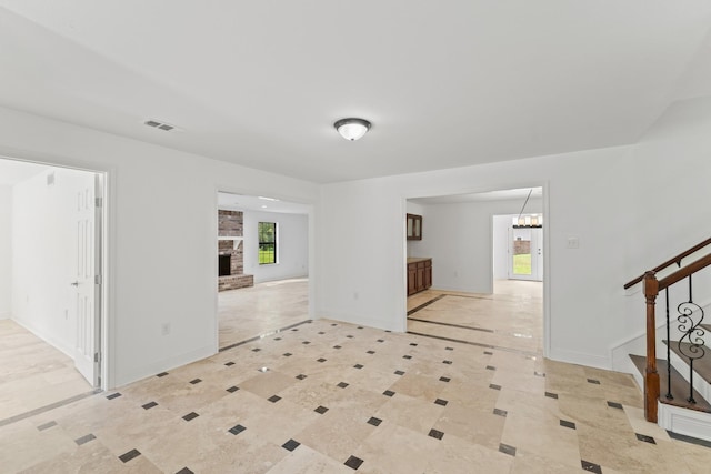 3310 Riviera Ln, Houston, TX 77338 - entryway featuring stairs, a fireplace, a chandelier, and baseboards
