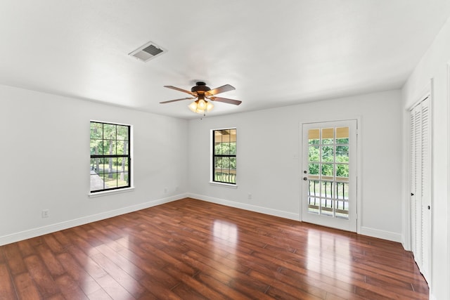 3310 Riviera Ln, Houston, TX 77338 - empty room with dark wood-style flooring, a ceiling fan, and baseboards