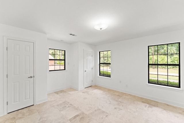 3310 Riviera Ln, Houston, TX 77338 - unfurnished bedroom with multiple windows and baseboards