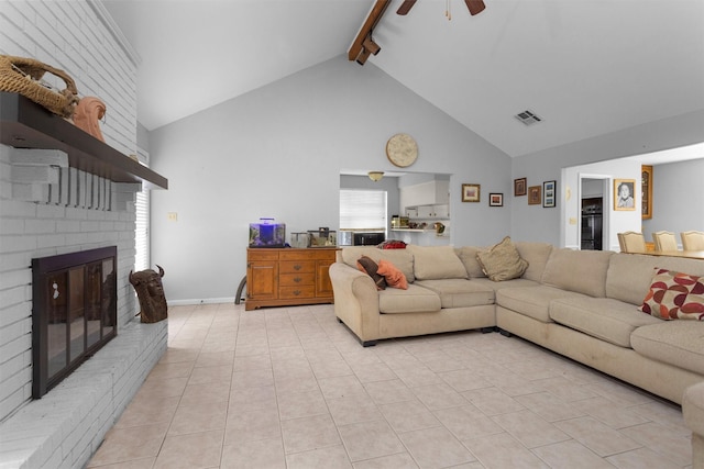 445 Augusta Dr, Huntsville, TX 77340 - living area featuring a ceiling fan, beamed ceiling, high vaulted ceiling, light tile patterned floors, and a brick fireplace