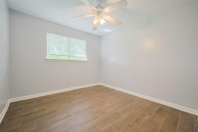 20101 Dawn Mist Dr, Humble, TX 77346 - spare room featuring wood finish floors, baseboards, ceiling fan, and a textured ceiling