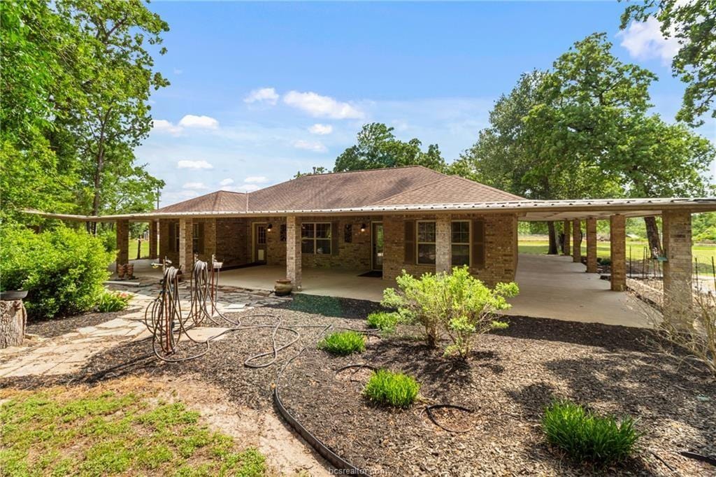 6448 Hwy 30, Anderson, TX 77830 - back of property with a patio and brick siding