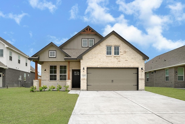 318 Little Spring Ct, Anahuac, TX 77523 - craftsman-style house featuring board and batten siding, brick siding, a front lawn, concrete driveway, and an attached garage