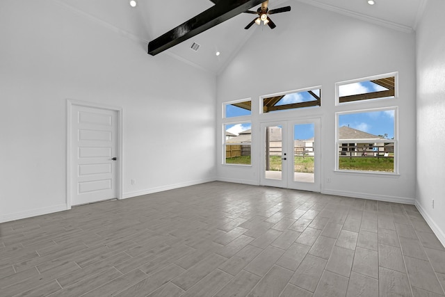 318 Little Spring Ct, Anahuac, TX 77523 - unfurnished room with beamed ceiling, high vaulted ceiling, wood finished floors, a ceiling fan, and french doors