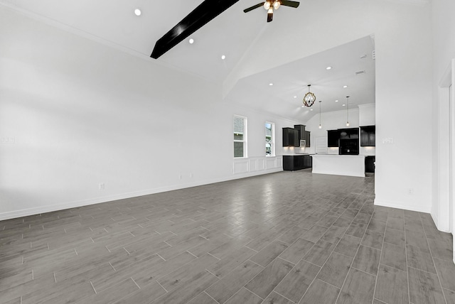 318 Little Spring Ct, Anahuac, TX 77523 - unfurnished living room featuring beam ceiling, ceiling fan, high vaulted ceiling, wood finished floors, and recessed lighting