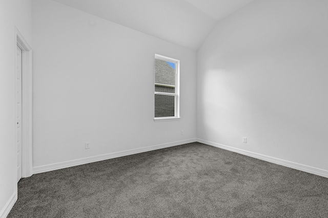 318 Little Spring Ct, Anahuac, TX 77523 - unfurnished room featuring lofted ceiling, dark carpet, and baseboards