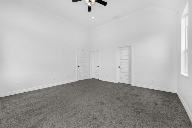 318 Little Spring Ct, Anahuac, TX 77523 - empty room featuring a ceiling fan, dark colored carpet, high vaulted ceiling, baseboards, and ornamental molding