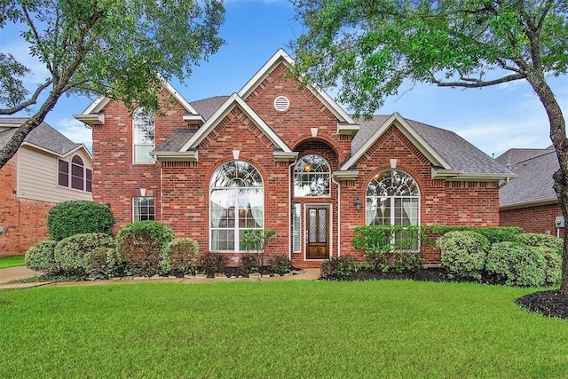11510 Misty Arch Ln, Cypress, TX 77433 - traditional home with brick siding and a front lawn