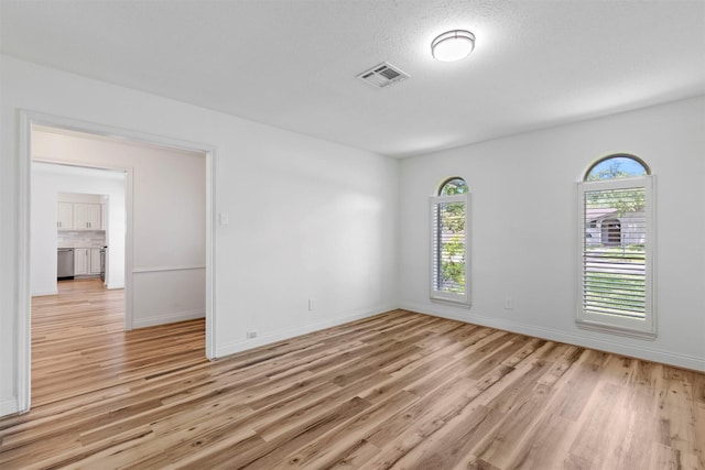 2407 Del Norte St, Houston, TX 77018 - spare room with light wood-type flooring and baseboards