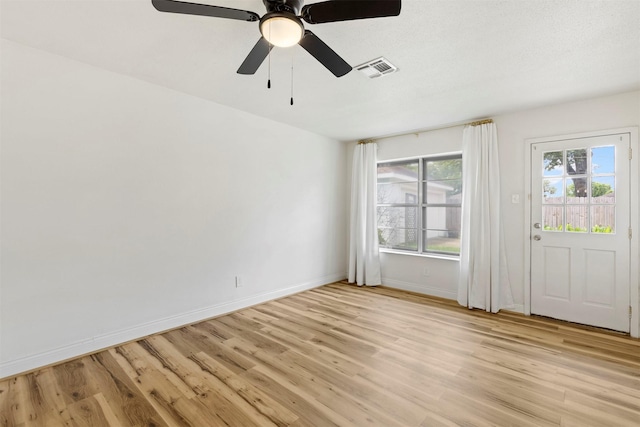 2407 Del Norte St, Houston, TX 77018 - unfurnished room featuring light wood finished floors, baseboards, and ceiling fan