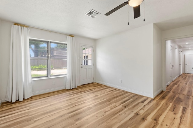 2407 Del Norte St, Houston, TX 77018 - unfurnished room with light wood-type flooring, a ceiling fan, and baseboards