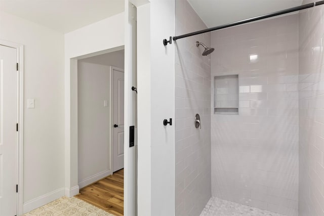 2407 Del Norte St, Houston, TX 77018 - full bath featuring a tile shower, baseboards, and wood finished floors