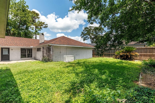 2407 Del Norte St, Houston, TX 77018 - back of house featuring brick siding, a chimney, and a shingled roof