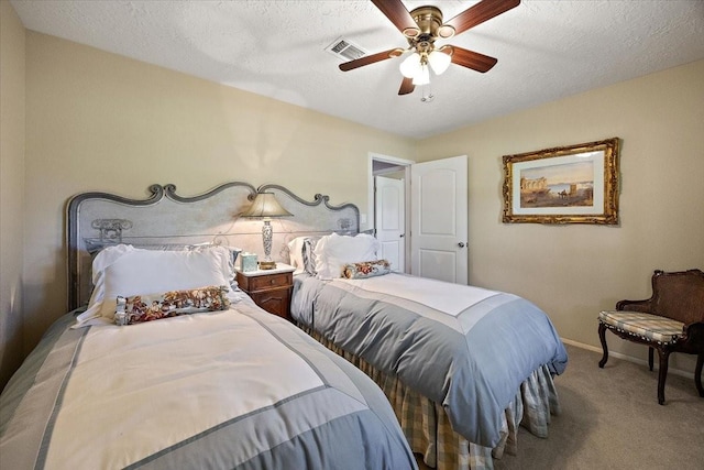 12392 Fm 355, Trinity, TX 75862 - carpeted bedroom featuring ceiling fan, baseboards, and a textured ceiling