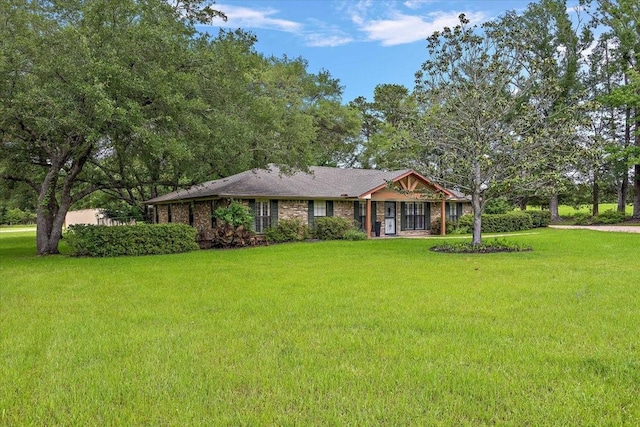12392 Fm 355, Trinity, TX 75862 - ranch-style house featuring a front yard