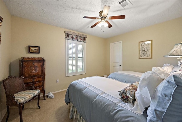 12392 Fm 355, Trinity, TX 75862 - bedroom featuring carpet, ceiling fan, a textured ceiling, and baseboards