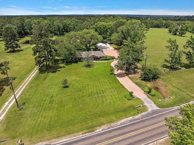 12392 Fm 355, Trinity, TX 75862 - aerial view of property and surrounding area with a heavily wooded area