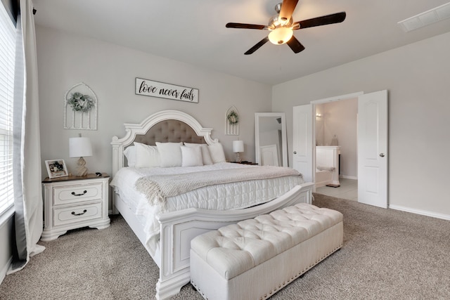 8619 Morning Dove Ln, Baytown, TX 77521 - bedroom featuring light colored carpet, ensuite bathroom, and a ceiling fan