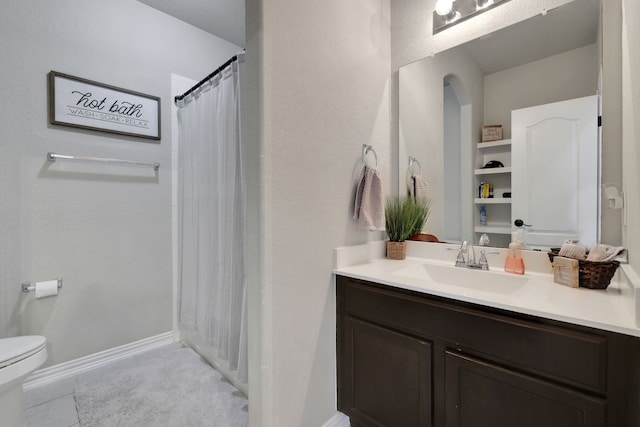 8619 Morning Dove Ln, Baytown, TX 77521 - full bath with toilet, vanity, curtained shower, baseboards, and tile patterned flooring