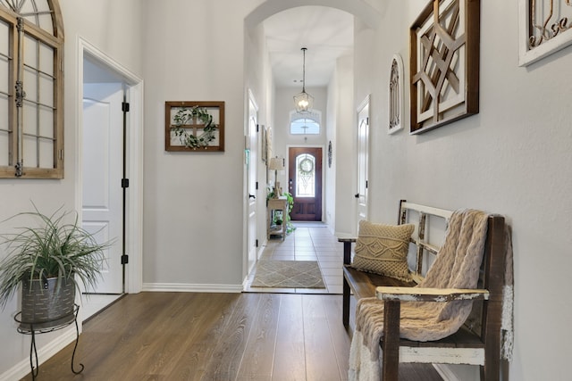 8619 Morning Dove Ln, Baytown, TX 77521 - entrance foyer featuring arched walkways, wood finished floors, baseboards, and a towering ceiling