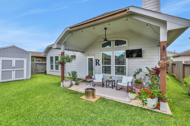 8619 Morning Dove Ln, Baytown, TX 77521 - back of property featuring ceiling fan, a storage unit, an outdoor structure, a chimney, and a patio area