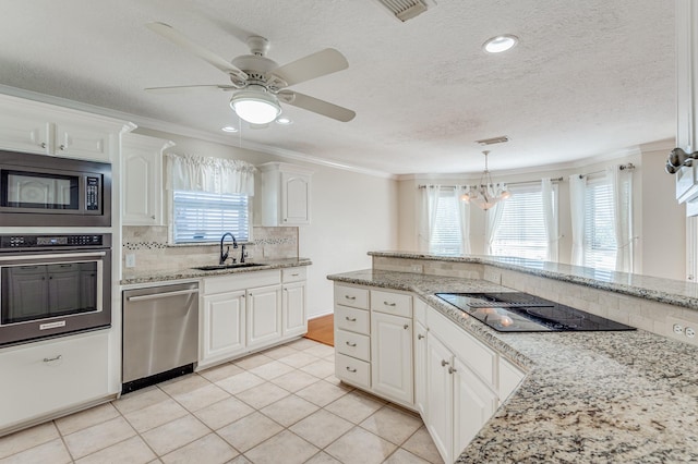 341 Sam, Houston Loop, Point Blank, TX 77364 - kitchen featuring stainless steel appliances, a sink, ornamental molding, backsplash, and a chandelier