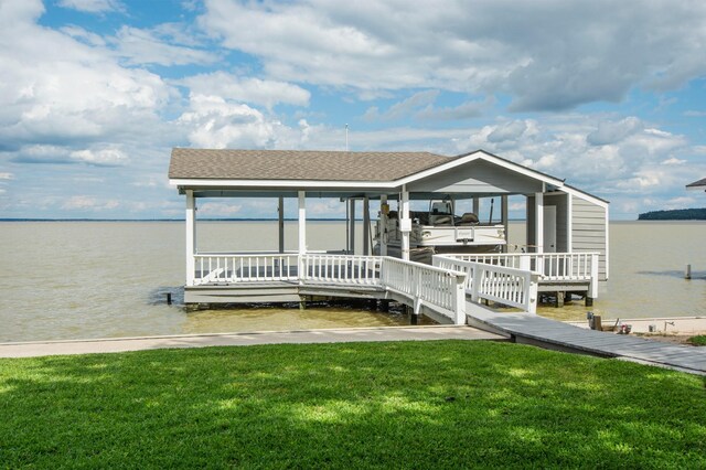341 Sam, Houston Loop, Point Blank, TX 77364 - view of front of house featuring a water view, boat lift, a front lawn, and a boat dock