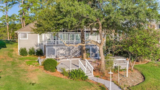 341 Sam, Houston Loop, Point Blank, TX 77364 - view of front of property with stairway, a patio area, a front yard, a sunroom, and a wooden deck