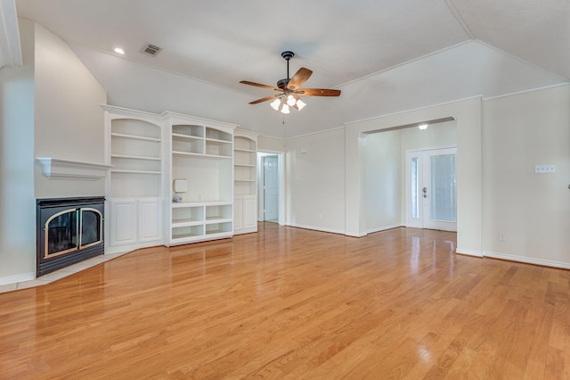 341 Sam, Houston Loop, Point Blank, TX 77364 - unfurnished living room featuring a ceiling fan, a fireplace with flush hearth, light wood-style floors, lofted ceiling, and baseboards